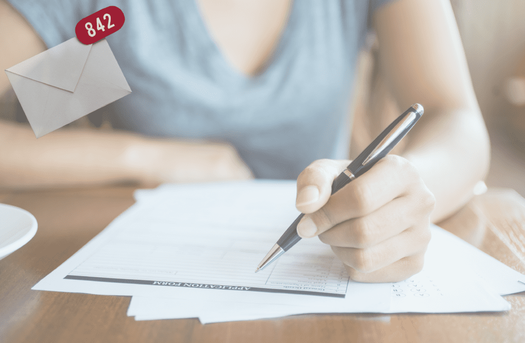 person sitting at desk writing