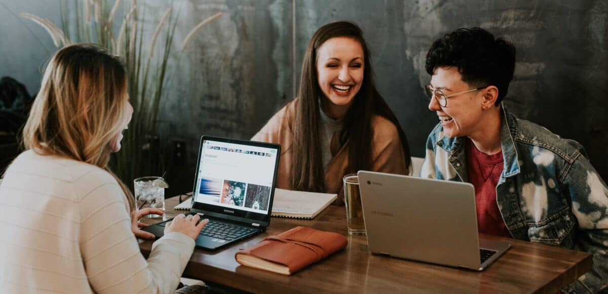 group of students working together laughing