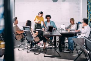 A group of people in a business meeting