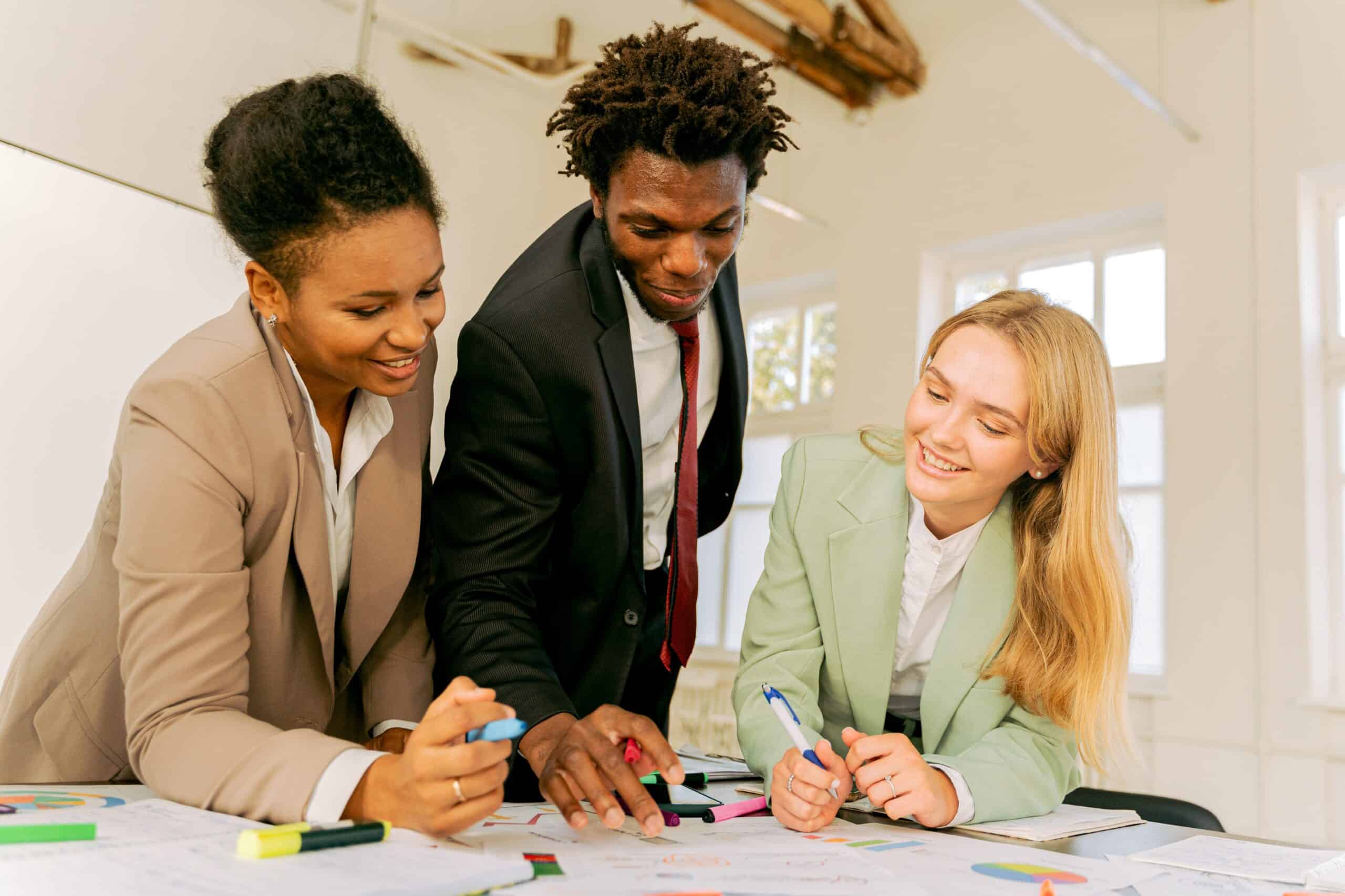 three employees communicating at work