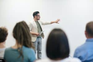 man using public speaking skills to present at work