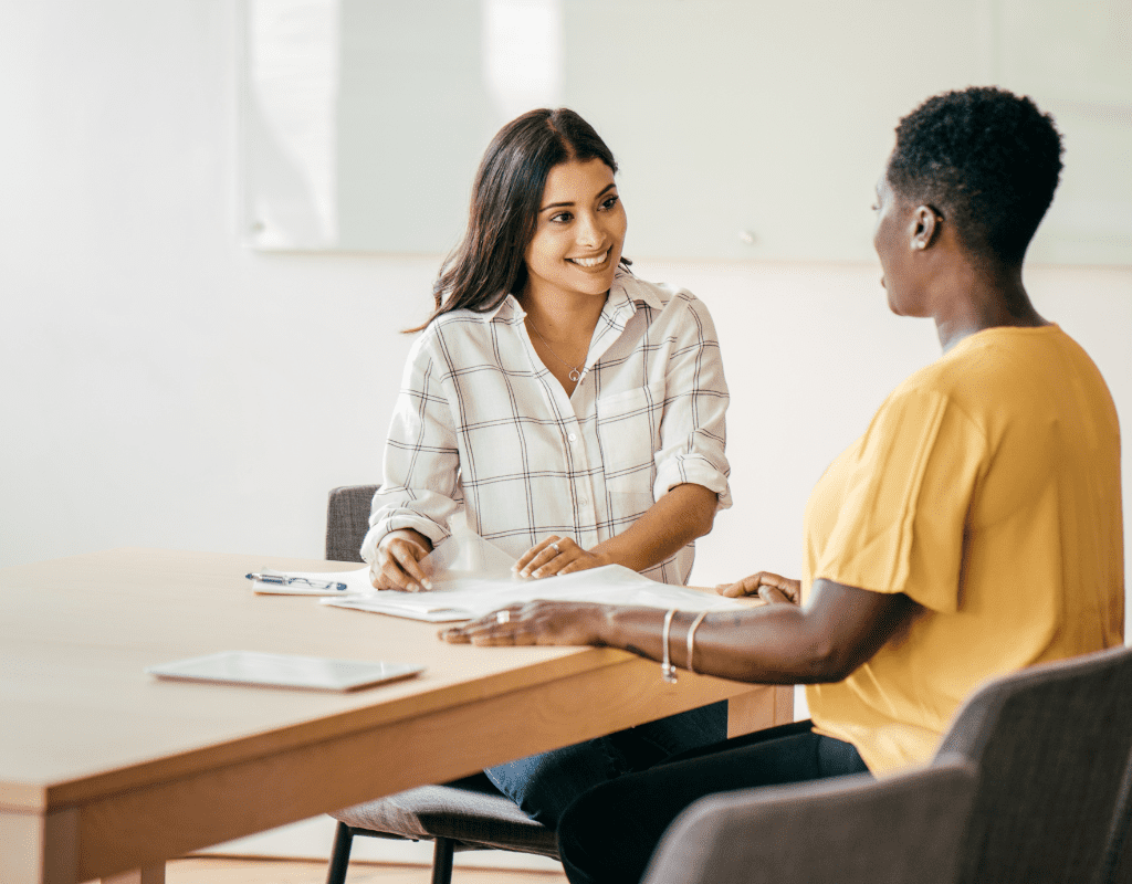 hiring manager interviewing candidate in person