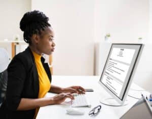 A woman learning how to write a resume