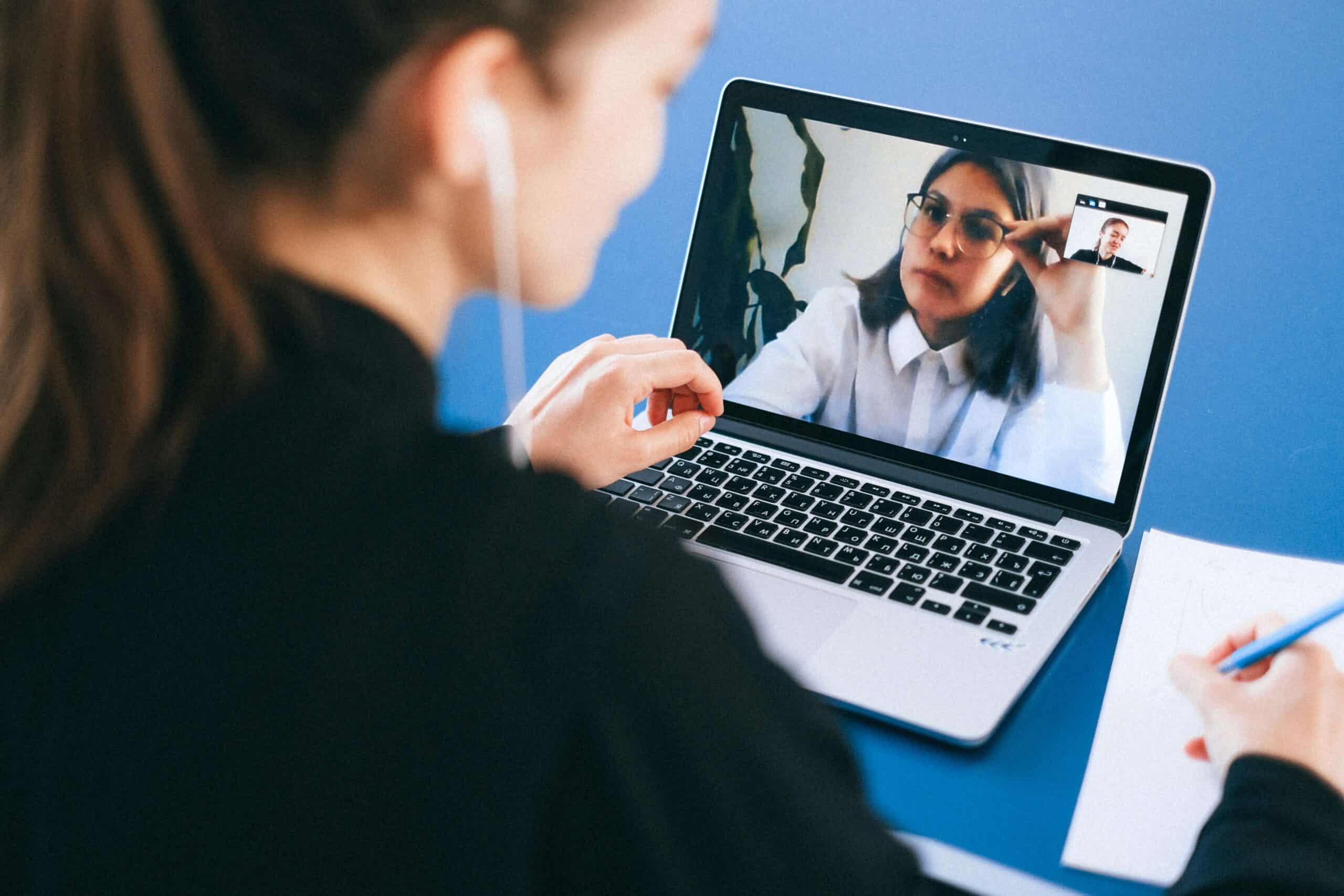student speaking in virtual interview