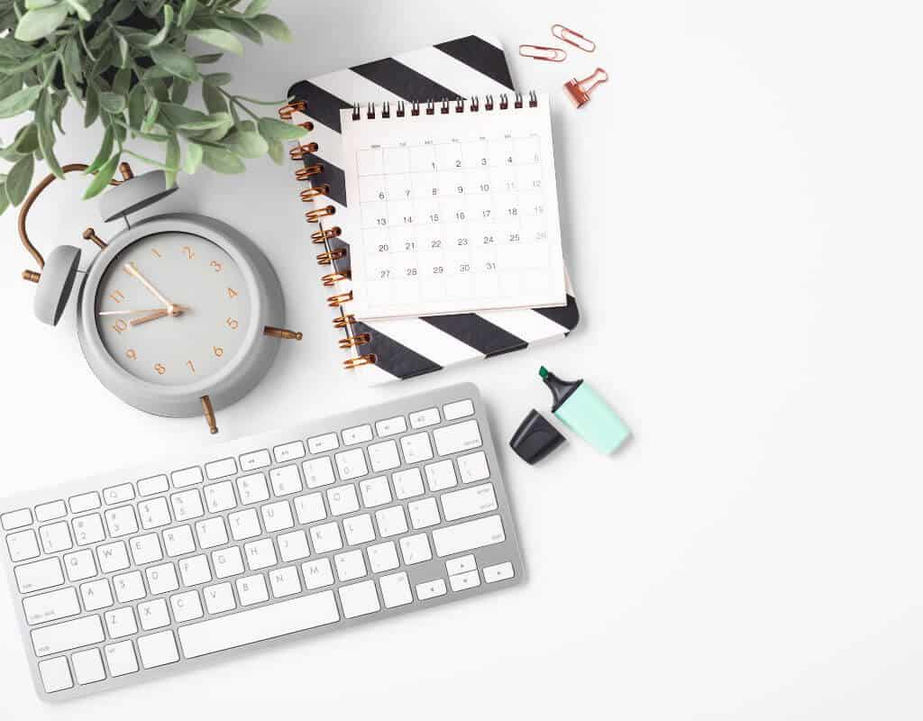 keyboard, calendar, and clock on desk