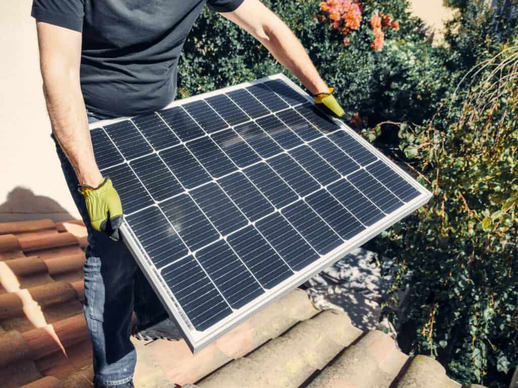 person holding solar panel