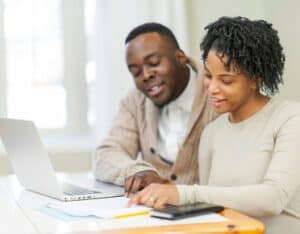 Couple reviewing their small business expenditures