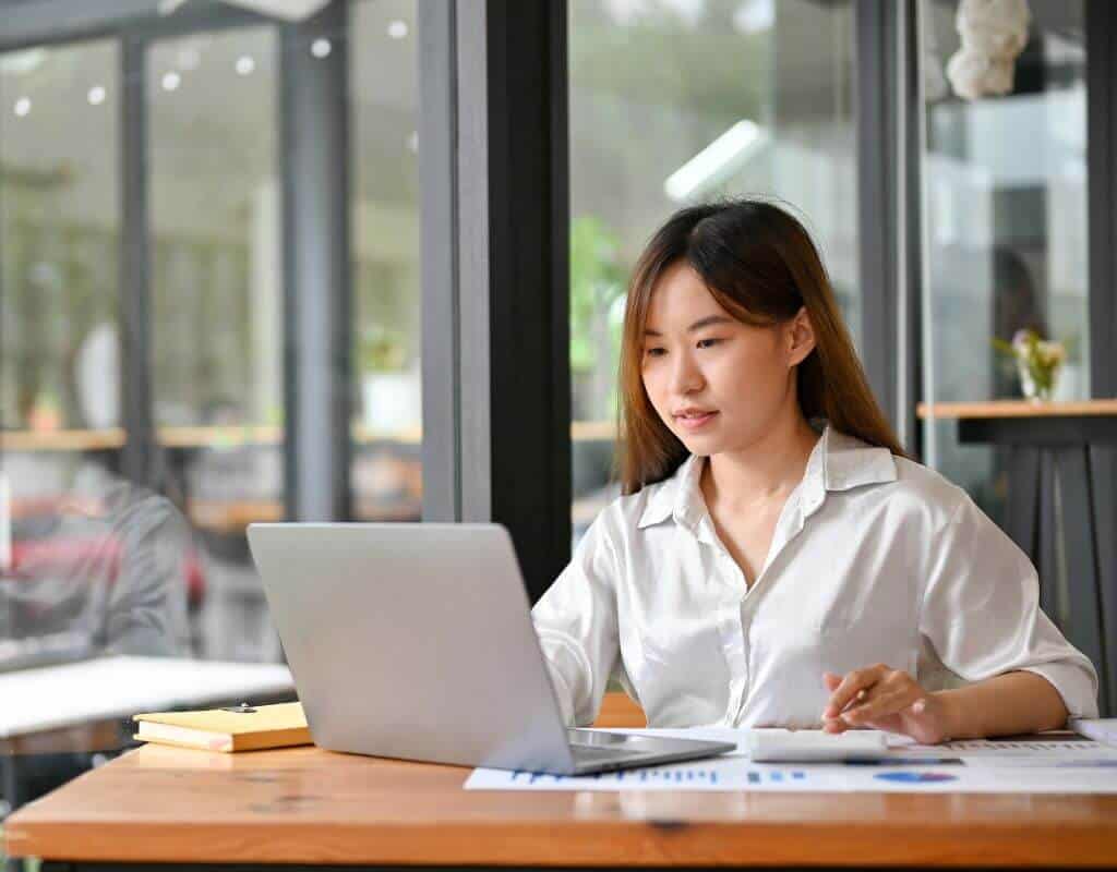 Financial analyst reviewing research