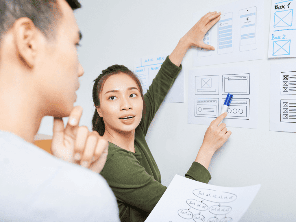 woman pointing to ux design prototype