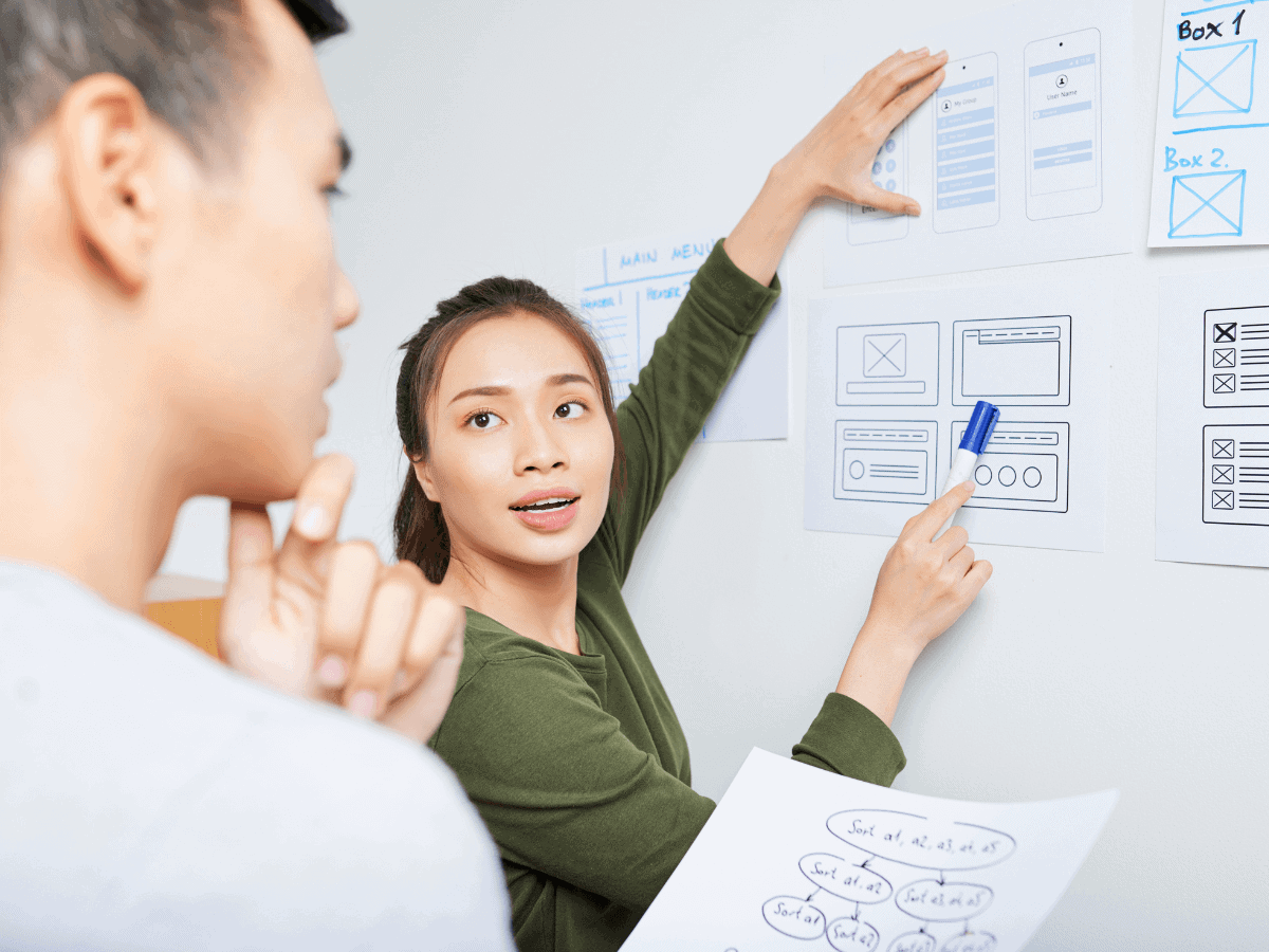 woman pointing to ux design prototype