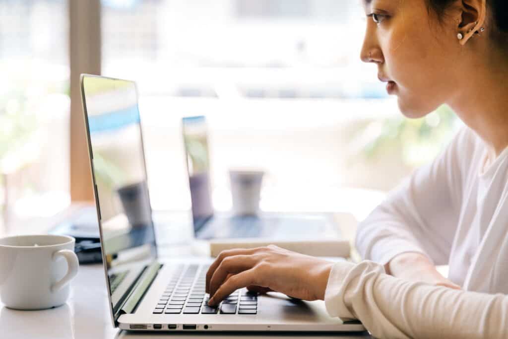 student looking at laptop