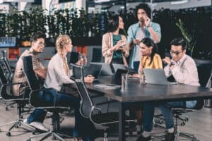 group of office workers meeting at a table